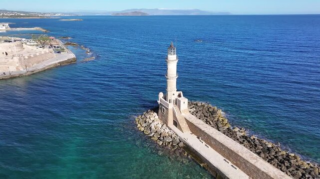 Aerial view of the lighthouse in the Mediterranean port (Venetian Harbour) of Chania, Crete, Greek Islands, Greece
