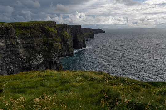 Cliffs of Moar overlooking the sea with a grassy foreground