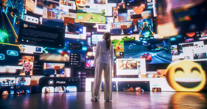 Back View Of Caucasian Woman Looking at 3D Cyberspace With Animated Social Media Interfaces, Online Video Games, Viral Videos, and Internet Content. Visualization Of Entertainment Technology Concept.