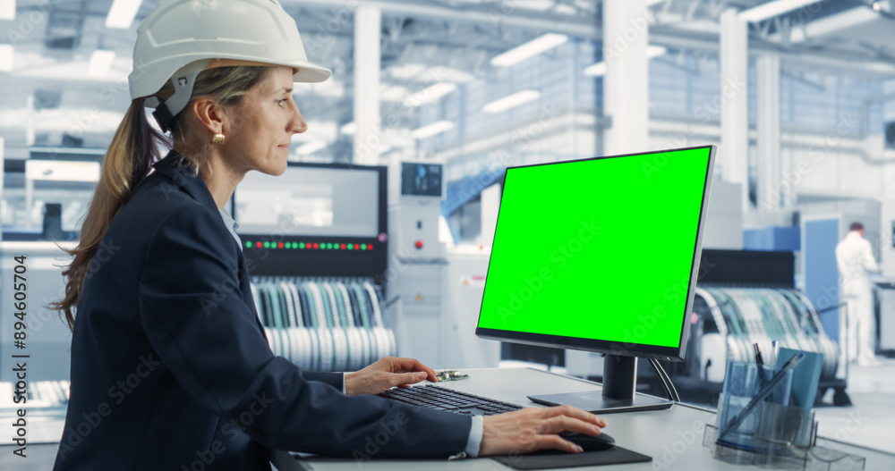 Poster Female Caucasian Software Developer Working on a Desktop Computer with Green Screen Chromakey On Display At an Industrial Plant. Technological Research and Development Office Monitoring the Production