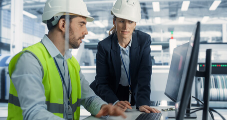 Electronics Research and Development Facility: Caucasian Female Project Manager Consults Male...