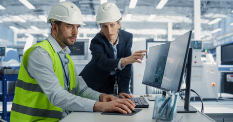 Electronics Research and Development Facility: Caucasian Female Manager Consults Male Engineer....