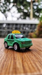 Toy cars in the shape of a green TAXI. Suitable for boys