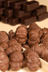 Christmas chocolates on the beige background