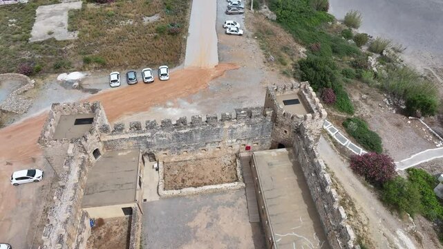 Aerial view of Venetian Castle of Frangokastello, in front of Lefka Ori Mountains (White Mountains), Chania region, Crete, Greek Islands, Greece