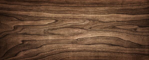 Walnut tree texture close up. Wide walnut wood texture background. Walnut veneer is used in luxury finishes.