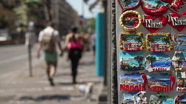 View of people, out of focus, and souvenirs on Corso Umberto, Naples, Naples, Campania, Italy