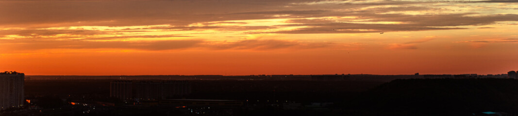 Panorama of a big city at dusk at sunset.