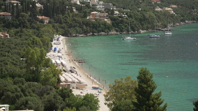 View of Ionian Sea and Paralia Mparmpati beach with hills in the background, Barbati, Corfu, The Ionian Islands, Greek Islands, Greece