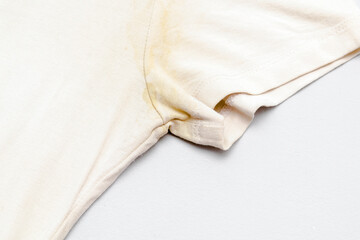 White t-shirt with dirty yellow sweat stain,spot on fabric and deodorant,spotter roller from...
