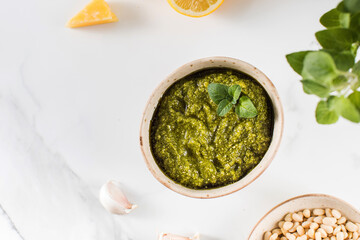 Fresh homemade pesto sauce in a bowl. Italian cuisine. Recipe. Copy space