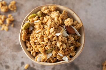 Crispy homemade granola with sliced almonds in a bowl. Healthy food
