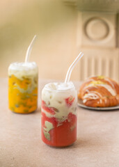 Passion fruit and strawberry iced drink. Summer cold drink. Vegetarian drink. Selective focus.