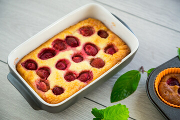 Sweet cottage cheese casserole with strawberry filling
