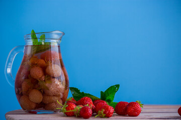 Sweet refreshing berry compote of ripe strawberries in a decanter