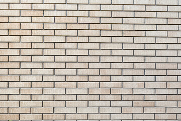 Yellow and textured brick wall background	