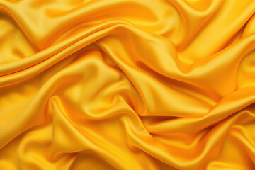 Luxurious yellow silk fabric with soft, flowing folds and a shiny, smooth texture. Perfect for fashion, design, and textile projects.