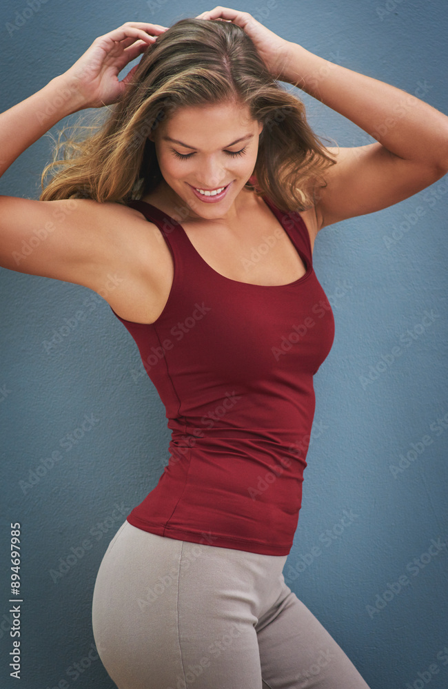 Sticker Happy, woman and dance portrait with smile, excited and dancer pose in studio with blue background. Modern, healthy lifestyle and confidence with athleisure outfit with health and wellness results