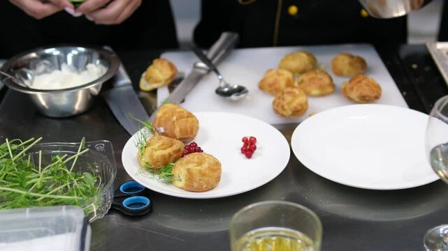 recipe step by step stuff profiteroles with cheese cream with microgreens. Profiteroles with shrimp, cream cheese and cucumber on a plate. Close-up on blue background, copy space