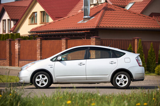 Berlin, Germany - May, 3 2024: Toyota Prius XW20 2009 hybrid electric car over out of focus rural background, left side view