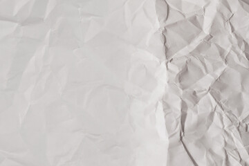 Crumpled white paper background.