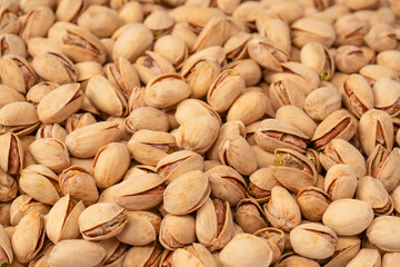 Tasty pistachios isolated on a white background.