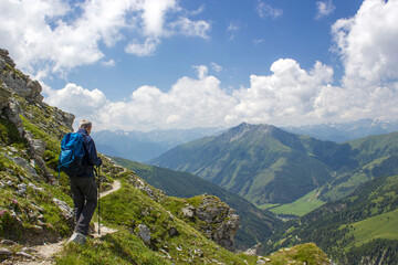 Fototapeta premium Man hiking in the High Tauern National Park, the Austrian Alps