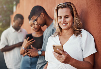 Wall background, phone and woman with business people in city for online website, b2b networking and about us. Creative agency, startup and men and women on smartphone for internet, chat and email