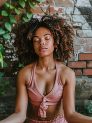 Fototapeta premium Young Woman Meditating in Urban Setting