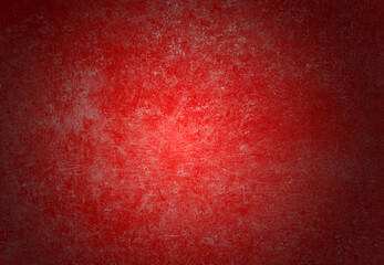The red concrete wall is scratched, blank, and has shadows.