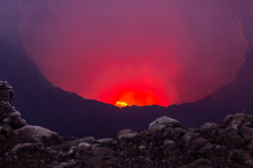 Glowing red lava lake of the active Masaya Volcano, Managua, Nicaragua. Close up of the bubbling...