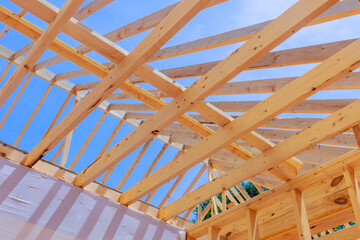 During construction of new house, wooden frame beams are used as framing in