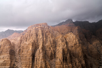 clouds over a canyon in UAE mountains