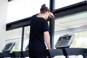 Man jogging in the fitness center Concepts for a healthy body.