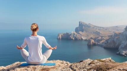 A person sits meditatively on a cliff edge overlooking a magnificent ocean view, expressing tranquility and mindfulness with the natural beauty of cliffs in the background.
