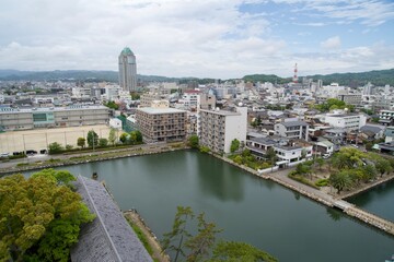 Fototapeta premium Moat from Imabari Castle and view of Imabari City