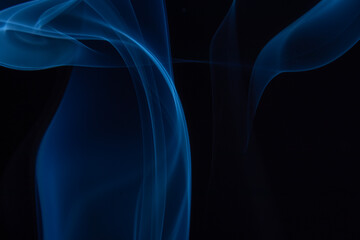 A photo of smoke that has a beautiful billowing appearance. Suitable for making background images.