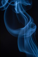 A photo of smoke that has a beautiful billowing appearance. Suitable for making background images.