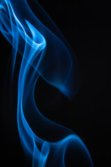 A photo of smoke that has a beautiful billowing appearance. Suitable for making background images.