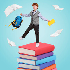 Happy schoolboy with backpack and textbook on stack of books against light blue background. Back to school