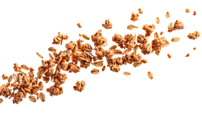 Close-up of granola scattered against a white background. Healthy breakfast food with oats, nuts, and honey forming a textured, crunchy mix.