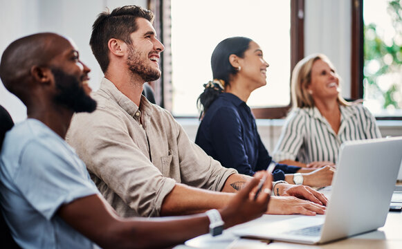 Attention, meeting and business people in conference room with laptop, smile and project development at seminar. Office, workshop and team at creative presentation with ideas, objectives or planning