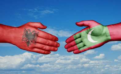 Maldives and Albania country handshaking with flags, consensus concept international co-operation illustration