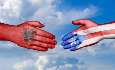 Puerto Rico and Albania country handshaking with flags, consensus concept international co-operation illustration