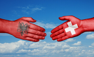 Switzerland and Albania country handshaking with flags, consensus concept international co-operation illustration