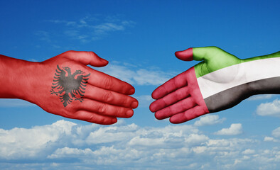 United Arab Emirates and Albania country handshaking with flags, consensus concept international co-operation illustration