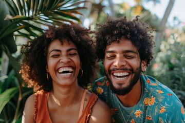 Portrait of a cheerful couple in their 20s laughing