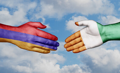 Ivory Coast or Cote d'Ivoire and Armenia country handshaking with flags, consensus concept international co-operation illustration