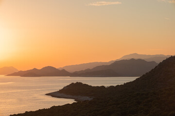 Sunset in the mountains with olive groves over the Mediterranean sea