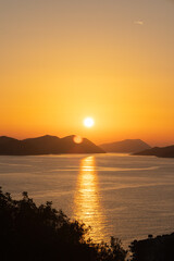 Orange sunset sun over the islands in the Mediterranean Sea